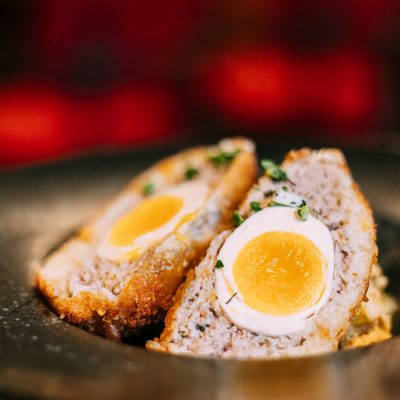 Traditional Scotch egg . Skirly is fried oatmeal with onions and spices, a classic garnish of